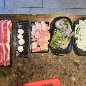 Hero Hotpot - From left to right: beef belly, fish balls, pork rib belly, shrimp, and tripe. - Hot Pot Near Me - Salt Lake City, Utah Hero Hotpot - From left to right: beef belly, fish balls, pork rib belly, shrimp, and tripe. - Hot Pot Near Me - Salt Lake City, Utah