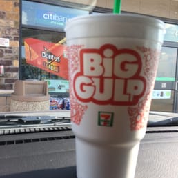 a drink in a plastic cup with a green straw a drink in a plastic cup with a green straw