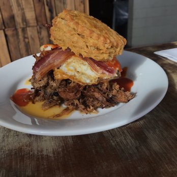Handsome Biscuit - Biscuit with pulled pork, bacon, over easy egg and in house hot sauce. - Breakfast & Brunch Near Me - Norfolk, Virginia Handsome Biscuit - Biscuit with pulled pork, bacon, over easy egg and in house hot sauce. - Breakfast & Brunch Near Me - Norfolk, Virginia