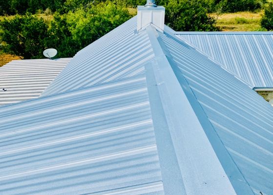 Fredericksburg Project-Fredericksburg, TX-Standing Seam Metal Roof Replacement - This roof replacement took place in Fredericksburg, TX. Skyline Roofing advocated on behalf of the policyholder to USAA for full roof replacement due to wind and hail damage and USAA agreed. We installed 23 gauge, standing seam steel, fabricated on premises, with the color selected being galvalume. The client was extremely please with the finished product. Fredericksburg Project-Fredericksburg, TX-Standing Seam Metal Roof Replacement - This roof replacement took place in Fredericksburg, TX. Skyline Roofing advocated on behalf of the policyholder to USAA for full roof replacement due to wind and hail damage and USAA agreed. We installed 23 gauge, standing seam steel, fabricated on premises, with the color selected being galvalume. The client was extremely please with the finished product.