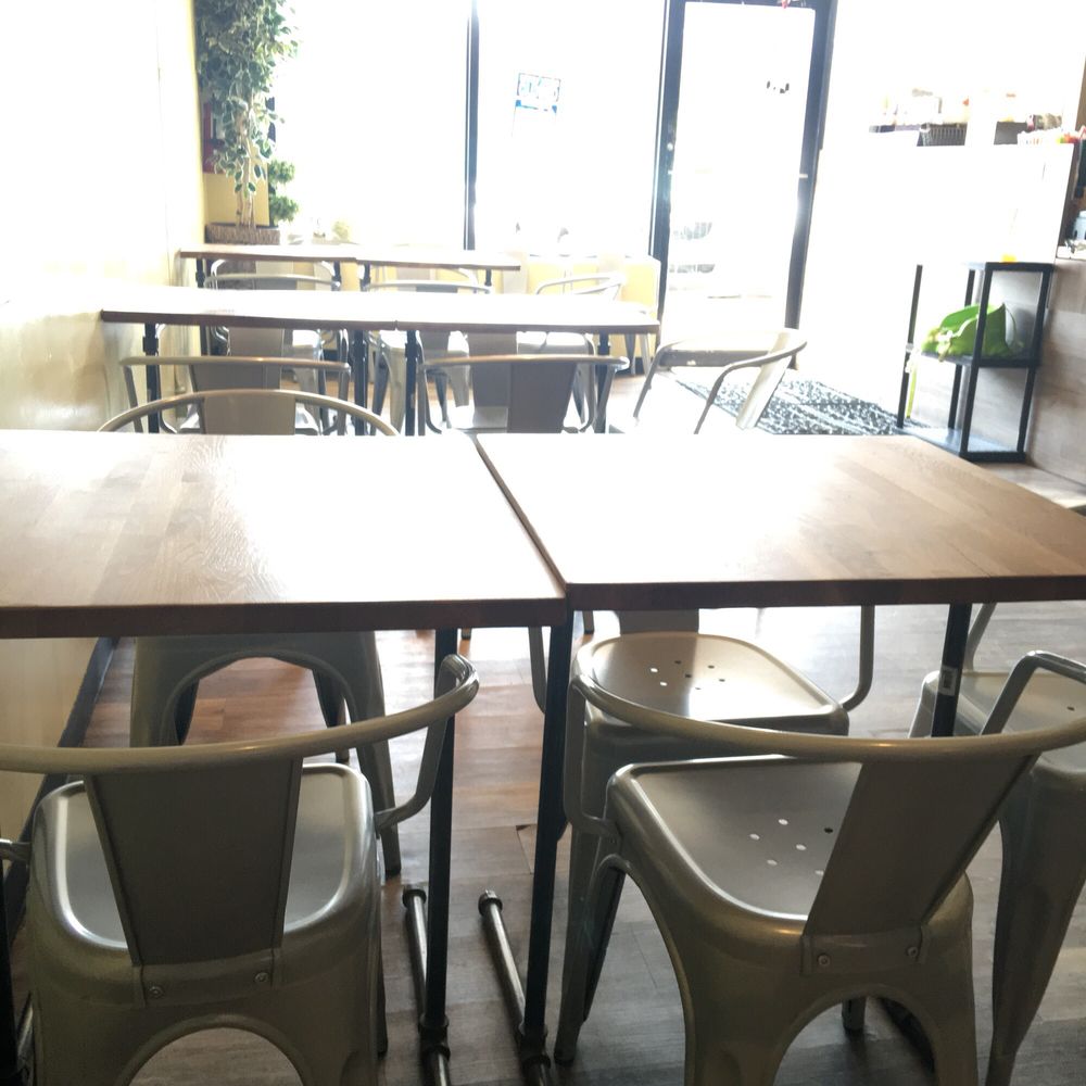 tables and chairs in a restaurant tables and chairs in a restaurant