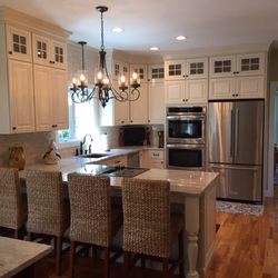 Hogan's Handyman Services - Custom kitchen with granite and tile backsplash.