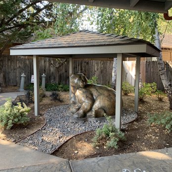 River's Edge Restaurant - a statue of a cow under a shelter - Steakhouses Near Me - Grants Pass, Oregon River's Edge Restaurant - a statue of a cow under a shelter - Steakhouses Near Me - Grants Pass, Oregon