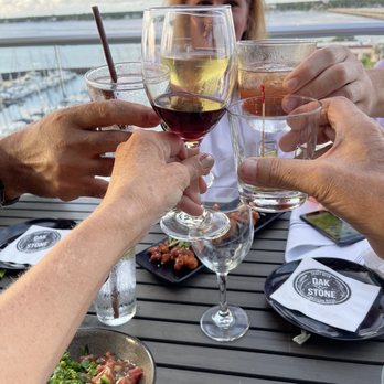 Oak & Stone - Cheers!! With the Manatee River in the background. - Pizza Near Me - Bradenton, Florida Oak & Stone - Cheers!! With the Manatee River in the background. - Pizza Near Me - Bradenton, Florida