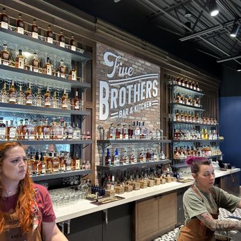 Five Brothers Bar & Kitchen - two people at the bar - Distilleries Near Me - Bardstown, Kentucky