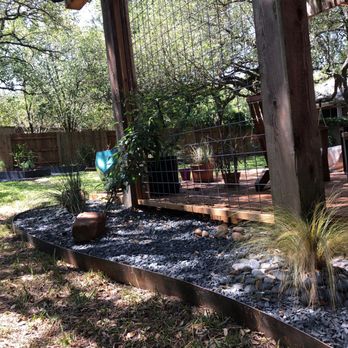 KG  - Side bed and hog wire privacy screen (will have vines covering it eventually). - Landscaping Near Me
