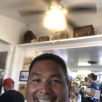 Main Street Cafe - Me with some vintage radios on the shelf behind me - Breakfast & Brunch Near Me - Fallbrook, California
