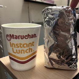 Gyro next to a ramen cup for comparison