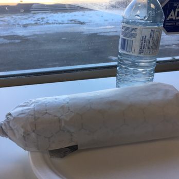Cosmic Pizza - a burrito wrapped in paper on a plate - Pizza Near Me - Sherwood Park, Alberta