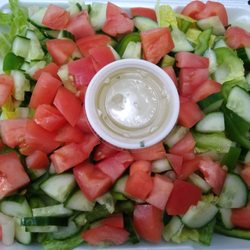 Closeup of the salad. Romaine lettuce, cucumbers, tomatoes and green peppers.