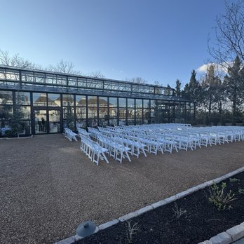 The Glasshouse - Wedding set up outside with reception in glasshouse - Venues & Event Spaces Near Me - Grandview, Missouri The Glasshouse - Wedding set up outside with reception in glasshouse - Venues & Event Spaces Near Me - Grandview, Missouri