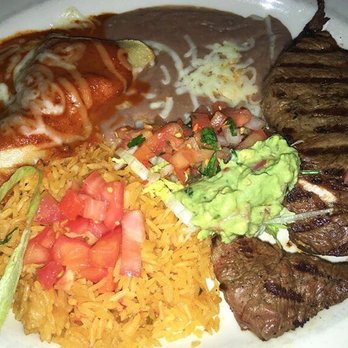 Mi Mexico Lindo - Steak tampiqueña. Grilled skirt steak, and a chicken enchilada covered mole. Served with refried beans and rice on the side. Delicious! - Mexican Near Me - Methuen, Massachusetts