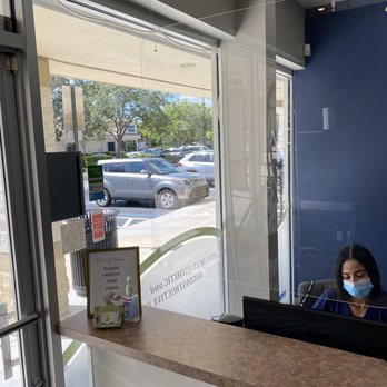 Smiles By Design: John Garcia - Front desk protective glass - General Dentistry Near Me - Weston, Florida