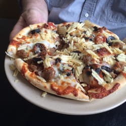 Gambino's Pizza - Monster with potato chips on top. They will add the chips if you ask.