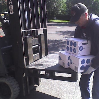 Maletis Beverage - a man loading boxes onto a forklift - Beer, Wine & Spirits Near Me - Portland, Oregon Maletis Beverage - a man loading boxes onto a forklift - Beer, Wine & Spirits Near Me - Portland, Oregon