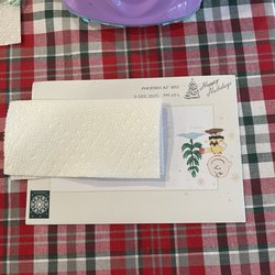 US Post Office - Showing in the front of the envelope with the post office stamp upside down