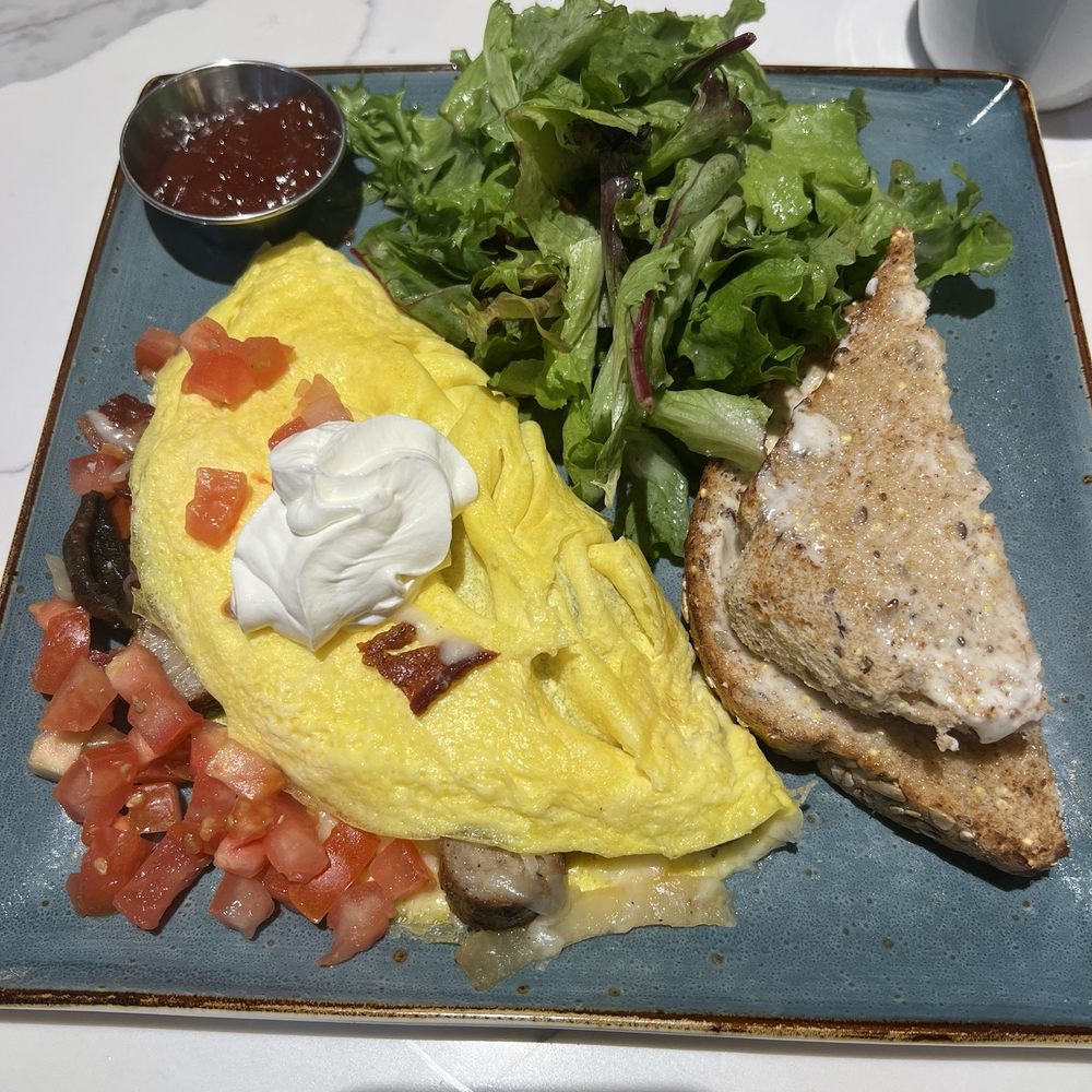 Fantastic omelet i was impressed even with the toast and jam and the salad was incredible.
