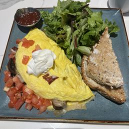 Fantastic omelet i was impressed even with the toast and jam and the salad was incredible.