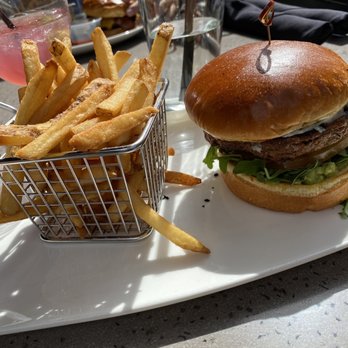 Yard House - Beyond burger with French fries drink is pomegranate margarita - New American Near Me - Sacramento, California Yard House - Beyond burger with French fries drink is pomegranate margarita - New American Near Me - Sacramento, California