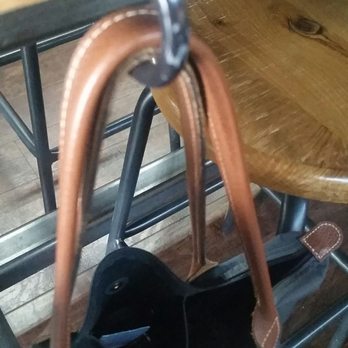 Whiskey Cake Kitchen & Bar - Convenient purse hooks - New American Near Me - Katy, Texas Whiskey Cake Kitchen & Bar - Convenient purse hooks - New American Near Me - Katy, Texas