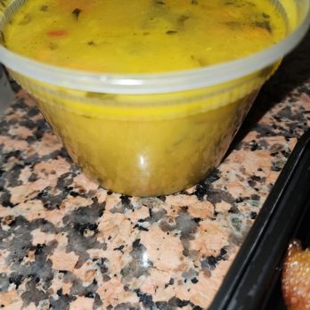 Stella's - a bowl of soup and a donut - Caribbean Near Me - Brooklyn, New York