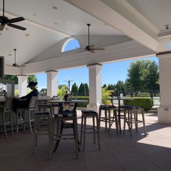 Big Spring Country Club - Outdoor patio and bar overlooking pool and golf course