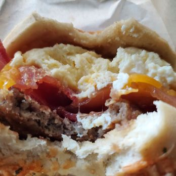 Madrona Cafe - Bacon, sausage, egg and cheese on a Asiago bun. Bomb-digity! - Cafes Near Me - Lakebay, Washington