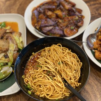 Little Tao - a variety of dishes of food on a table - Szechuan Near Me - Boston, Massachusetts