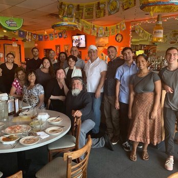 Baja's Authentic Mexican Restaurant - Our family with the servers (far left and middle leaning on dad's chair) and head cook (center in white). - Mexican Near Me - Orange, Connecticut Baja's Authentic Mexican Restaurant - Our family with the servers (far left and middle leaning on dad's chair) and head cook (center in white). - Mexican Near Me - Orange, Connecticut