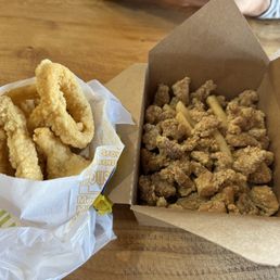 Fried Calamari Rings and fried Crispy Popcorn Chicken and Fries