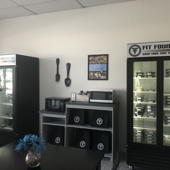 Fit Foundation - a room with a refrigerator and a table - Food Delivery Services Near Me - Crest Hill, Illinois