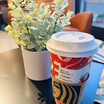 Starbucks - a cup of coffee and a plant on a table - Coffee & Tea Near Me - Harrisburg, North Carolina Starbucks - a cup of coffee and a plant on a table - Coffee & Tea Near Me - Harrisburg, North Carolina