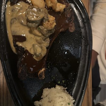 Outback Steakhouse - 13oz Ribeye* & shrimp with Tasmanian sauce and mashed potatoes - Steakhouses Near Me - Greensboro, North Carolina Outback Steakhouse - 13oz Ribeye* & shrimp with Tasmanian sauce and mashed potatoes - Steakhouses Near Me - Greensboro, North Carolina