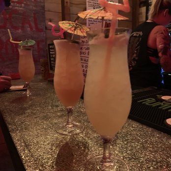 Dirty Laundry - two cocktails on a bar - Tiki Bars Near Me - Orlando, Florida Dirty Laundry - two cocktails on a bar - Tiki Bars Near Me - Orlando, Florida
