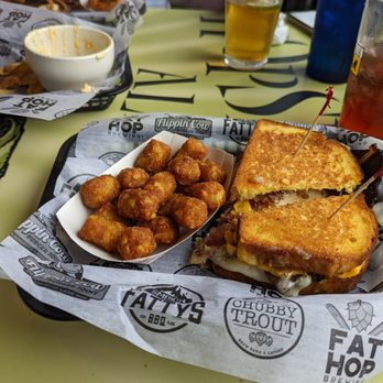 Flippin' Cow - Smoked Bacon Brisket Grilled Cheese with tater tots. - Burgers Near Me - Elkhart, Indiana