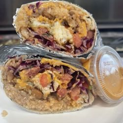The Real Taco - Fish burrito.. rice,beans,pico de gallo,red cabbage and spicy mayo sauce!!