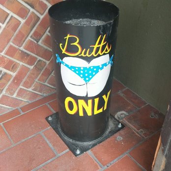 The King's Den - a black trash can with a blue bandanna on it - Dive Bars Near Me - Salinas, California