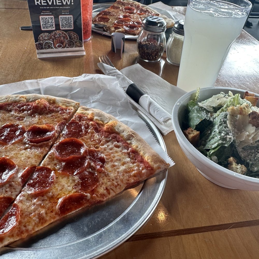 2 slices of pepperoni pizza, Cesar salad and a lemonade. 2 slices of pepperoni pizza, Cesar salad and a lemonade.