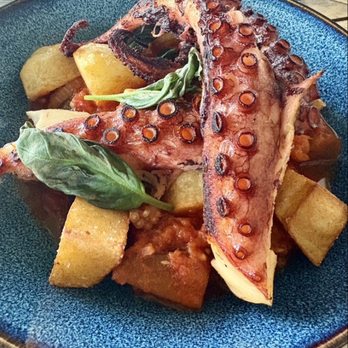 Café Violette - Braised and seared octopus with crispy potatoes and a ratatouille sauce - Mediterranean Near Me - Blowing Rock, North Carolina Café Violette - Braised and seared octopus with crispy potatoes and a ratatouille sauce - Mediterranean Near Me - Blowing Rock, North Carolina