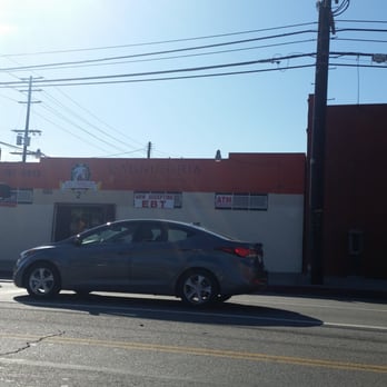 Los Tres Potrillos - a car parked on the side of the road - Butcher Near Me - Los Angeles, California