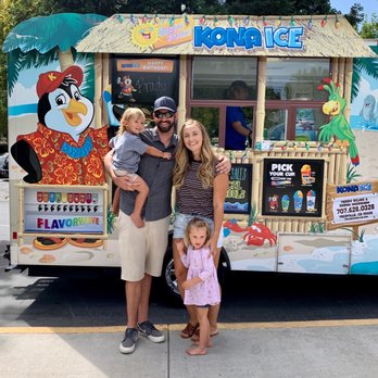 Kona Ice of Fairfield - a family standing in front of a food truck - Shaved Ice Near Me