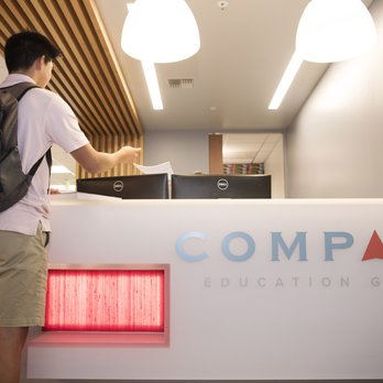 Compass Education Group - Student walking into the office. - Test Preparation Near Me Compass Education Group - Student walking into the office. - Test Preparation Near Me