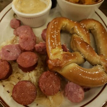 Sutter Buttes Brewing - German sampler plate...mixed sausages with sour crout, pretzel, beer cheese, warm potato salad - Pubs Near Me - Yuba City, California