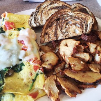 Christo's Cafe - Spinach, tomato and cheese omelette with added mushrooms, marble rye toast, and deep fried home fries. Perfection! - Breakfast & Brunch Near Me - Orlando, Florida
