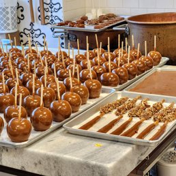 several trays of caramel apples