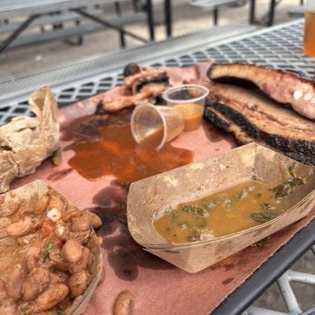Lewis Barbecue - The aftermath of cowboy beans, collard greens, pork spare ribs, and brisket. - Barbeque Near Me - Charleston, South Carolina