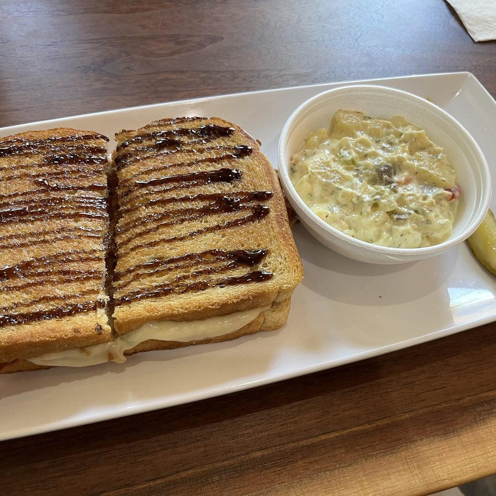 Jitters Coffee House - Apricot, bacon, and brie sandwich with a side of potato salad - Coffee & Tea Near Me - Concordia, Kansas Jitters Coffee House - Apricot, bacon, and brie sandwich with a side of potato salad - Coffee & Tea Near Me - Concordia, Kansas