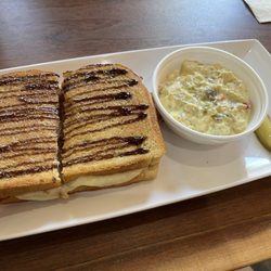 Jitters Coffee House - Apricot, bacon, and brie sandwich with a side of potato salad