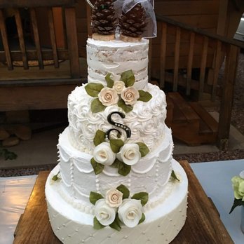 Silver Rose Bakery - cabin in forest white wedding - three tier cake with fourth tier dummy - ivory roses - heart topper and pine cone bride and groom topper - 2 - Custom Cakes Near Me - Phoenix, Arizona Silver Rose Bakery - cabin in forest white wedding - three tier cake with fourth tier dummy - ivory roses - heart topper and pine cone bride and groom topper - 2 - Custom Cakes Near Me - Phoenix, Arizona