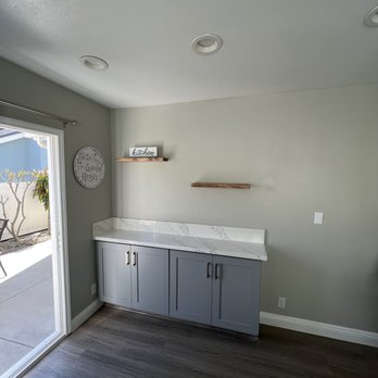 Pech Services - a kitchen with a sliding glass door - Carpenters Near Me Pech Services - a kitchen with a sliding glass door - Carpenters Near Me